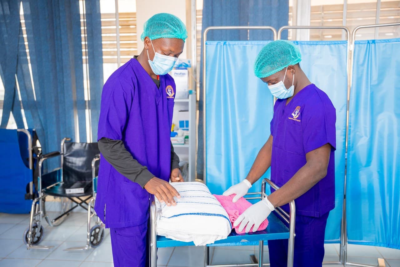 Students preparing linens for patient care
